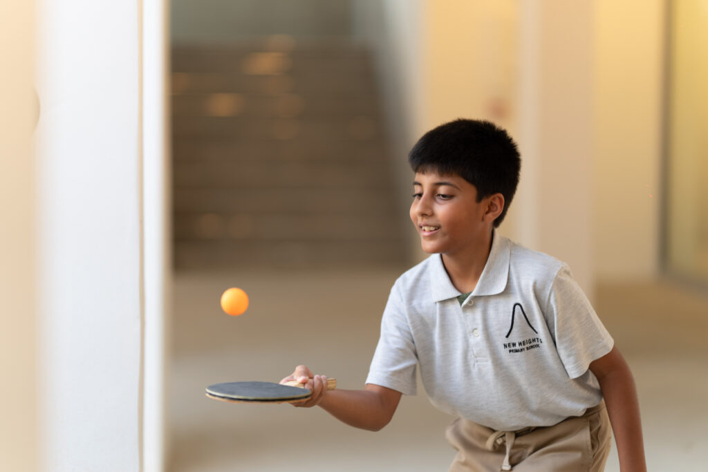 A New Heights student playing table tennis