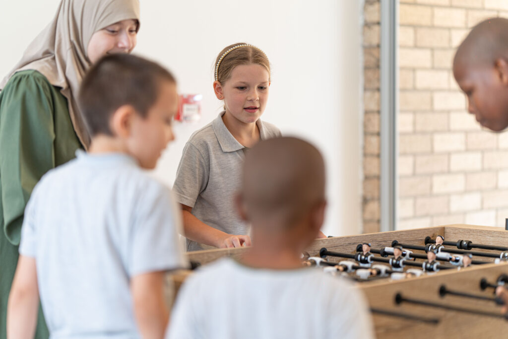 New Heights students enjoying table football